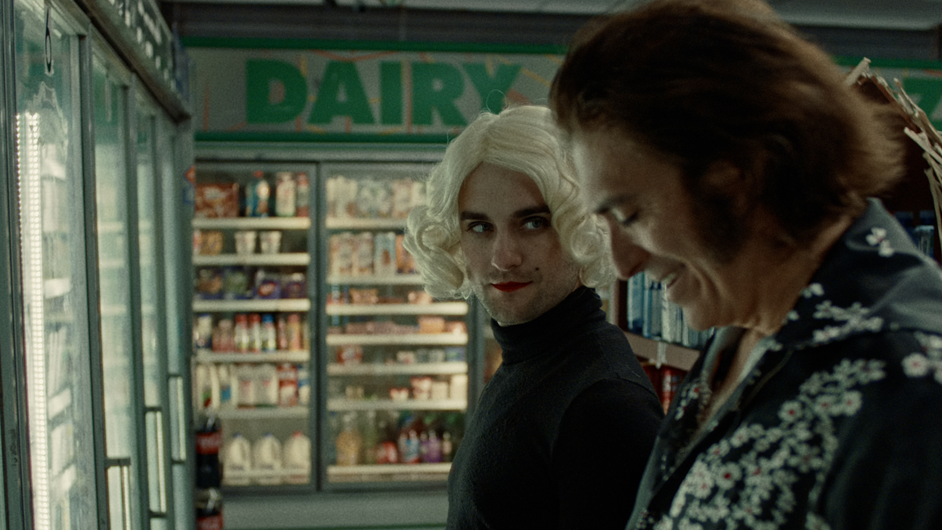 Two characters share an intimate glance in a convenience store